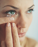 Contact lenses lady putting contact lense in eye